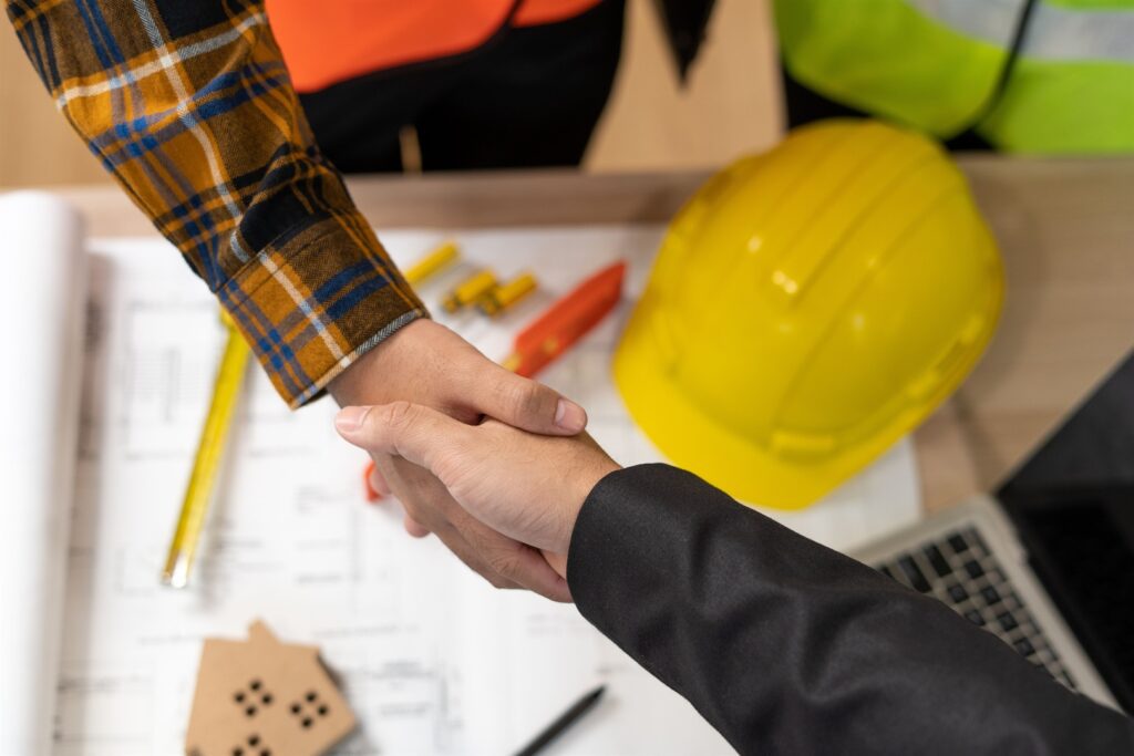shaking hands with customer - Get It Done Restoration